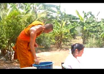Buddhist Monk Blessing and Showering